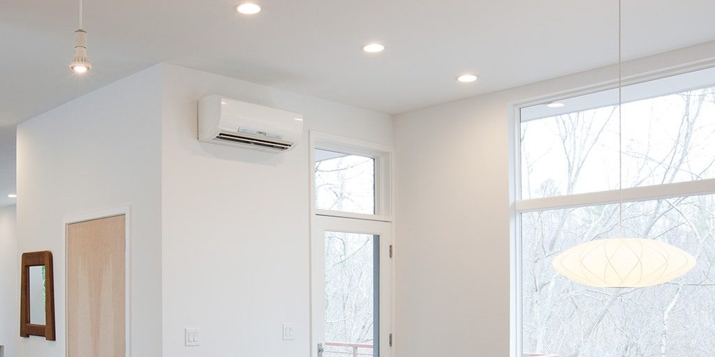 white ductless heat pump on white wall | Solve Heating problems with ductless mini splits | Kansas City| AB May